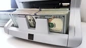 Real time video of Banknote Counter counting 100 dollar bills on a...