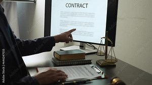 Young lawyer or legal advisor is reading and carefully checking the validity of documents and investment agreements for signing contracts managing justice concepts.