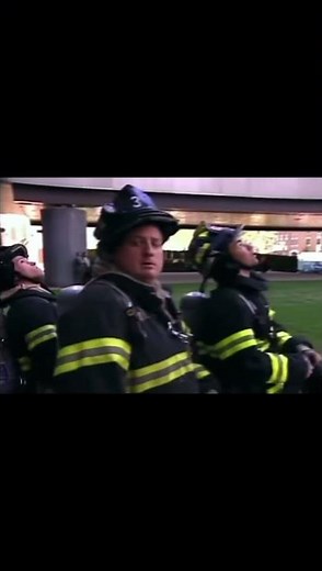 9/11 Firefighters watch as people jump out of the twin towers