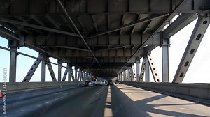 San Francisco, CA - Aug 16, 2021: 4K HD video driving POV lower deck of the Bay Bridge with mild traffic congestion due to left lane closure for road work.