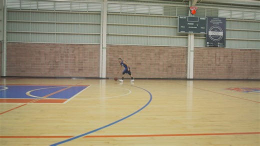 Basketball player shooting baskets while training alone - Free Stock Video