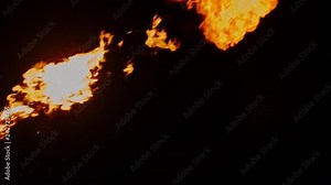 Cool fire show artist breathes fire in dark air, performing amazing stunts - extreme slow motion