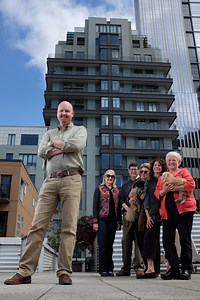 Beneath a vast blue sky piled high with billowy white clouds, Kyle | Seattle Weekly