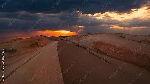 Timelapse of sunset over the sand dunes in the desert. Gobi desert
