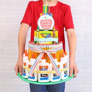 4.5M views · 4.2K reactions | Make a giant cake out of school supplies! What a fun teacher gift idea for back-to-school! FULL SUPPLY LIST AND WRITTEN TUTORIAL: https://www.thecraftpatchblog.com/school-supply-cake-tutorial/ | The Craft Patch | Facebook