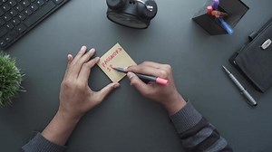 Writing password on a sticky note