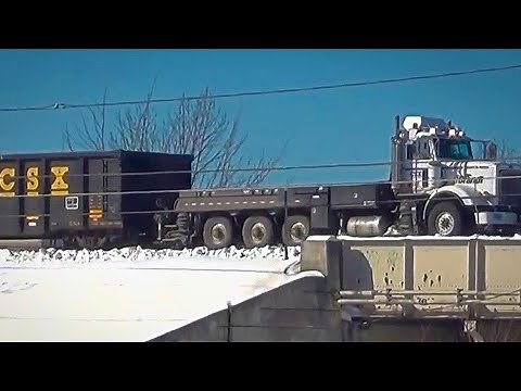 Semi Truck Towing a Train Meets 60 MPH Van Train!