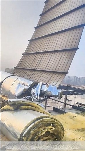 Removal of corrugated steel roofing: using a crane for overall lifting.
