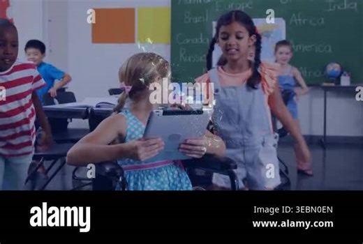 Girl in wheelchair turning tablet to classmate for learning, sparking holo-map outlining tablet. Classroom, collaboration, technology, holographic, map, engagement, inclusion Stock Video Footage - Alamy