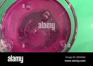 Effervescent tablet dissolving in water, closeup