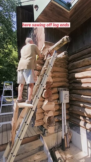 This handmade ladder jack allows you to work safer on a ladder when using both hands like we are here sawing off log ends. #logcabin #loghome #loghomeliving #loghomes #laddersafety #ladderjack #ladderwork #chainsaw #chainsawman #arboristlife #carpentrywork #carpentryskills #carpentrytools #homerenos #diytools #diytips #scaffolding #sidinglife #sidingcontractor #cottagereno #toolsofthetrade #tricksofthetrade #bluecollarlife | Meyers.makes