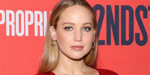 Jennifer Lawrence Layered Her Enormous Crimson Red Coat Over a Slinky LBD