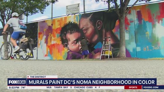 Artists paint murals in DC's NoMa neighborhood