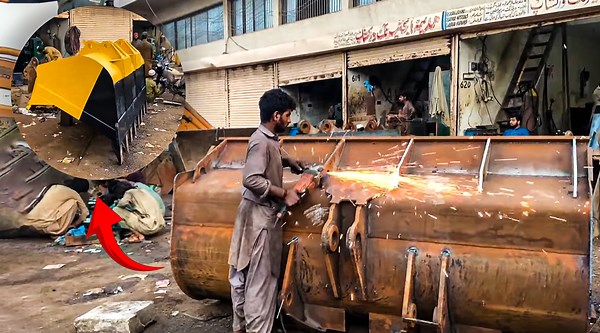 Skilled Hands Shaping Heavy Duty Loader Bucket Design