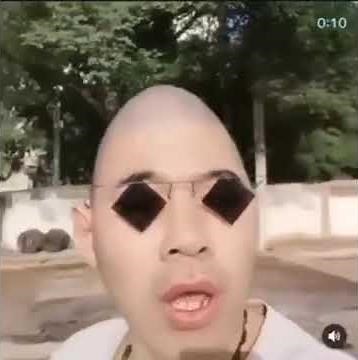 EggHead Man singing.