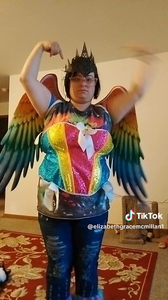 Colorful Rainbow Costume Performance with Vibrant Wings