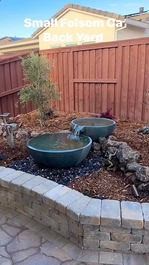 This small back yard project turned out so nice! With 4 separate sitting areas and lots of curves it feels bunch bigger than it is. There are so many eye catching details in this design. WeThe owner loves it so much she wants a front yard to match. #naturalswimponds #landscapedesig #waterfalls #waterfeature #small backyards | Clear Water Designs