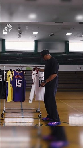 Book gives his dad a first-look at his new jersey number 💜🥹