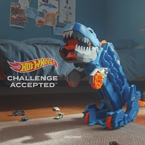 A terrifying T-Rex turns into a racetrack with 2 awesome cars with the Hot Wheels Ultimate Hauler T-Rex Transporter Playset! | Mattel