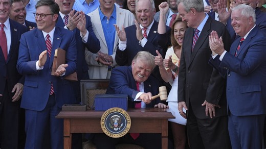 Trump signs his tax and spending cut bill at the White House July 4 picnic