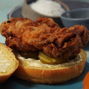 These super-crispy fried chicken sandwiches get extra deep flavor from a buttermilk and dill pickle brine. GET THE RECIPE: https://bit.ly/3AwJeQt | Food & Wine