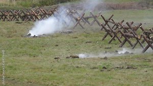 The shelling of defensive structures. Artillery shells barriers