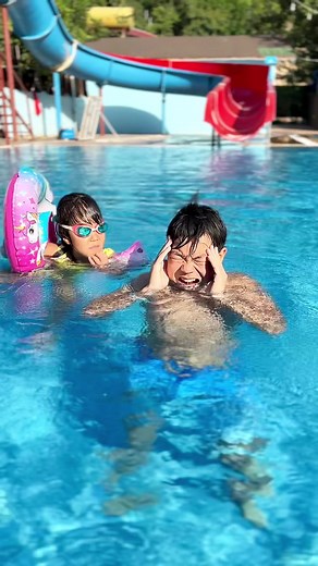 Children's Pool Fun: Swimming and Playing Together