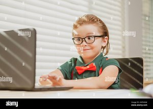 Schoolboy studying homework math during her online lesson at home. Pupil study with video call teacher Stock Photo - Alamy