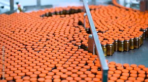 vaccine injection caps, manufacturing line vial bottle on a conveyor belt in a Pharma production factory injections in small ampoule vials factory process with latest hi tech machinery. pharma