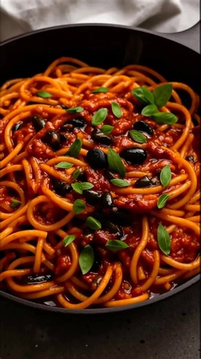 Craving a burst of flavors? This Spaghetti with Puttanesca Sauce is a delightful mix of salty, tangy, and spicy goodness! 🍝✨ #PastaLovers #Delicious Ingredients: - 200g / 7oz spaghetti (or your favorite long pasta) - 2 tbsp extra virgin olive oil (plus a bit more for drizzling) - 2 garlic cloves, finely minced (try using a knife for the best texture) - 3 anchovy fillets, finely minced - 1/4 cup pitted black olives (preferably in oil, quartered) - 1 tbsp capers, drained - 1/4 tsp chili flakes (r
