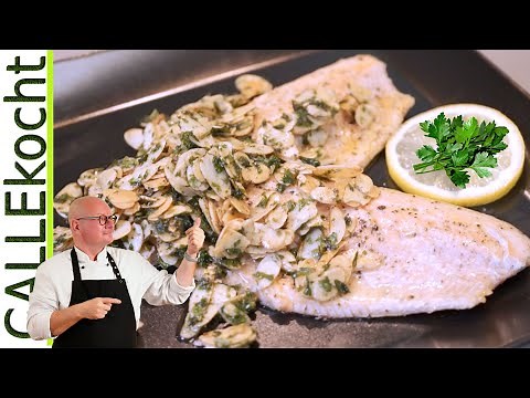 Forellenfilets in der Pfanne braten und mit Mandelbutter zubereiten.