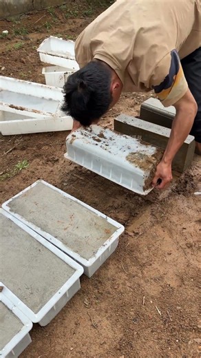 The man is using the technique of demolding the cement board