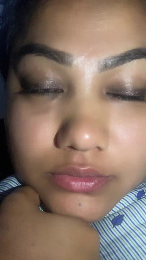 Close-Up Portrait: Striped Garment with Blue Leaves