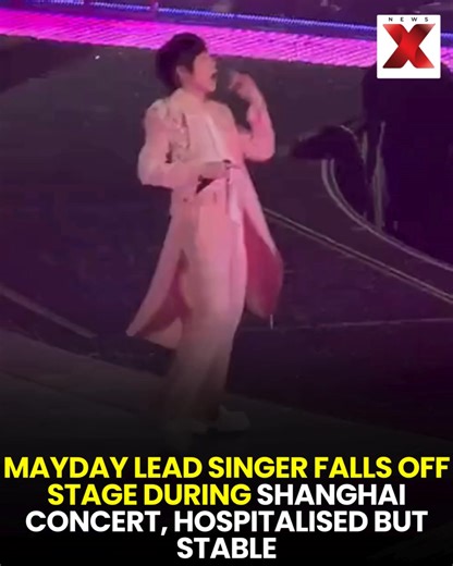 Shanghai: The lead singer of Taiwan’s famous rock band #Mayday fell about 2 meters off the stage during a concert. His head hit the lighting equipment. He got up, continued performing, joked with fans, and was later taken to the hospital. He is currently stable. #Shanghai #Mayday #ConcertIncident #LiveShow #RockBand #StageFall #MusicNews #singerinjured | NewsX