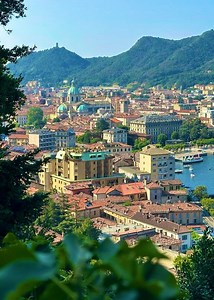17K views · 4.4K reactions | Located on the Italian-Swiss border, the city of Como in Italy overlooks the southwest end of its lake and is surrounded by green ridge hills | Lake Como | Facebook