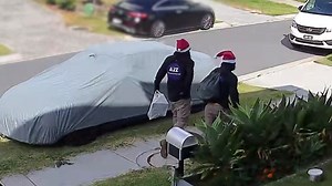 Trio charged with armed robbery after allegedly forcing their way into Brisbane house disguised as delivery men