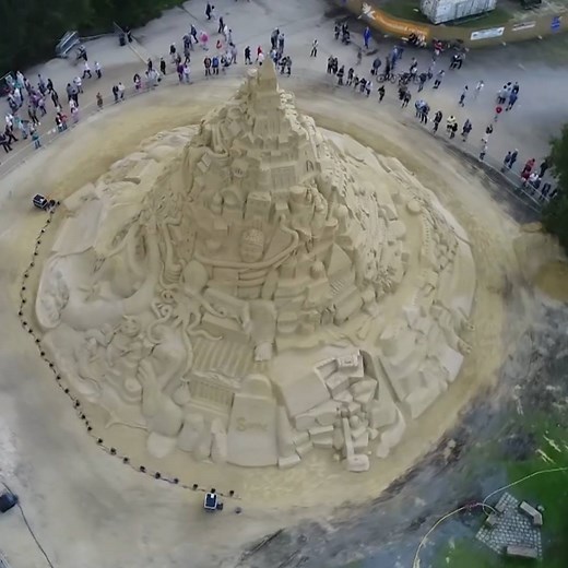 The world’s tallest sandcastle now stands at nearly 55 feet tall in the German city of Duisburg. A group of international sculptors spent more than three weeks constructing the sandcastle and used 3,500 tons of sand. The castle will be on display until at least September 24 and the site has so far been visited by around 180,000 people, according to a local tour operator who organized the event. | TIME