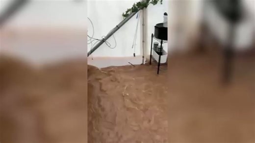 Storm Chandra batters Devon as floodwaters submerge riverside cafe