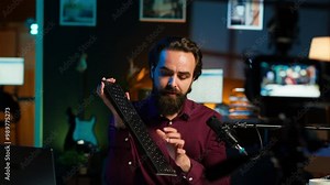 Influencer endorsing wireless mouse and keyboard from sponsor, showing functionalities. Internet star promotes computer peripherals from partnering brand to followers on social media, camera A