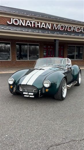 Jonathan Motorcars on Instagram: "Our First Green Cobra 🐍 Listen to this Beauty! - 1965 @backdraft_racing Cobra RT4 - British Racing Green - Eminent Pearl White Stripes - @prestige_moto 427 MPI (Fuel Injection) 500HP - Caramel Leather Interior - Autometer OEM Style Gauges - Heated Seat - Oil Cooler - Aluminum Gas Tank - Aluminum Radiator, Shroud, Fan - 3M Clear Film Paint Protection - Power Steering - Big and Tall Edition and more… #JMCCobra #shelby #427 Available Now‼️ ☎️609-871-2700 💻JMCCobr
