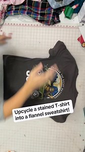 Stained T-shirt with a super cool graphic on the back turned into an amazing flannel sweatshirt! Do you guys like the decision I made with the sleeves? ##upcycle##sweatshirt##thrifting##sustainability | Madi Mac Fashions