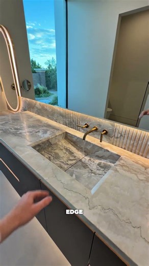 This bathroom vanity has a marble counter, double stacking drawer and a makeup vanity!