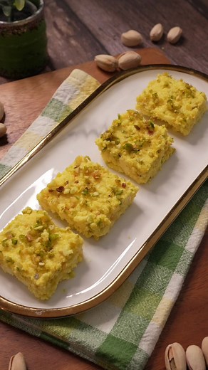 KESAR PISTA KALAKAND - Excited to share my latest creation - Kesar Pista Kalakand made with the finest California Pista! 🌰🧡 This traditional Indian sweet is perfect for the upcoming festive seasons of Rakshabandhan, Navratri, and Diwali. The combination of saffron and pistachios gives this dessert a rich and luxurious flavor that is sure to impress your family and friends.The key to a successful kalakand is to cook the milk and condensed milk mixture until it reaches the perfect consistency, a