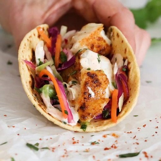 3.1M views · 2.8K shares | This easy, healthy cod fish taco recipe is seasoned with a chili-lime cumin rub topped with slaw and creamy lime sauce – no breading, no frying! You can use cod or any white fish! 5b 7g 5p SP • 342 Calories Print: https://www.skinnytaste.com/cod-fish-tacos/ | Skinnytaste | Facebook