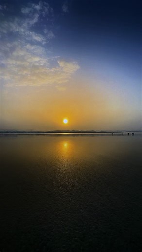 Intense Sunrise Over Foggy Beach