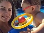 Katherine Webb splashes around in the pool with her son Tripp