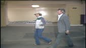 Merle Haggard enters Nelson's tour bus.
