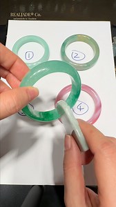 Which One Is the Real Jadeite? �Let’s put your jade knowledge to the test! Listen closely… each of these four bangles has its own voice.�Tap them gently and you’ll hear a difference:�some sound dull and flat, others crisp and resonant.�That sound matters — because genuine jadeite has a bright, clear, bell-like tone thanks to its tight crystal structure. We’ve lined up four bangles for you.�Only one of them is true jadeite.�The others? Just imitations trying their best to pretend. Pay attention t