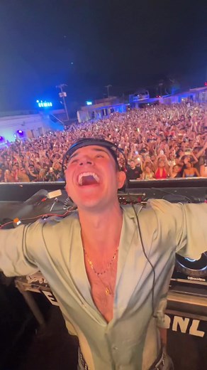 Exciting DJ Performance at Nighttime Concert