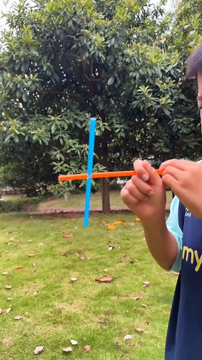 paper crafts creator on Instagram: "Step-by-Step Straw Pinwheel Toy 🌈🌀✨ Steps: • Take a square sheet of colored paper and fold it diagonally both ways, then unfold. • Cut along each diagonal crease about halfway to the center. • Fold every other corner tip toward the center and secure with glue. • Place a small bead or button in the center to hold the folds. • Use a pin to attach the pinwheel to the top of a plastic straw (or stick). • Make sure the pin is loose enough so the pinwheel can spin